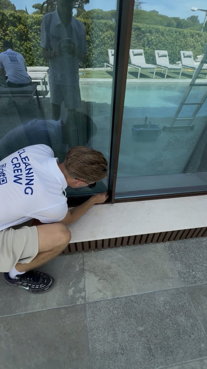Cleaning sliding door frames and tracks at a villa in Vale do Lobo