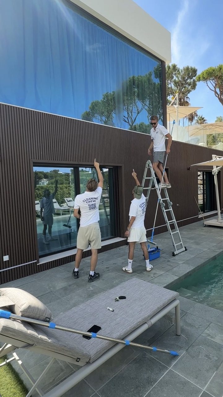 Two of the crew on the glass at a villa in Vale do Lobo